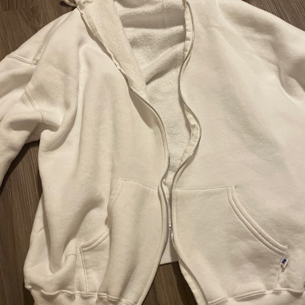 a cute white zip up to throw over your outfits!